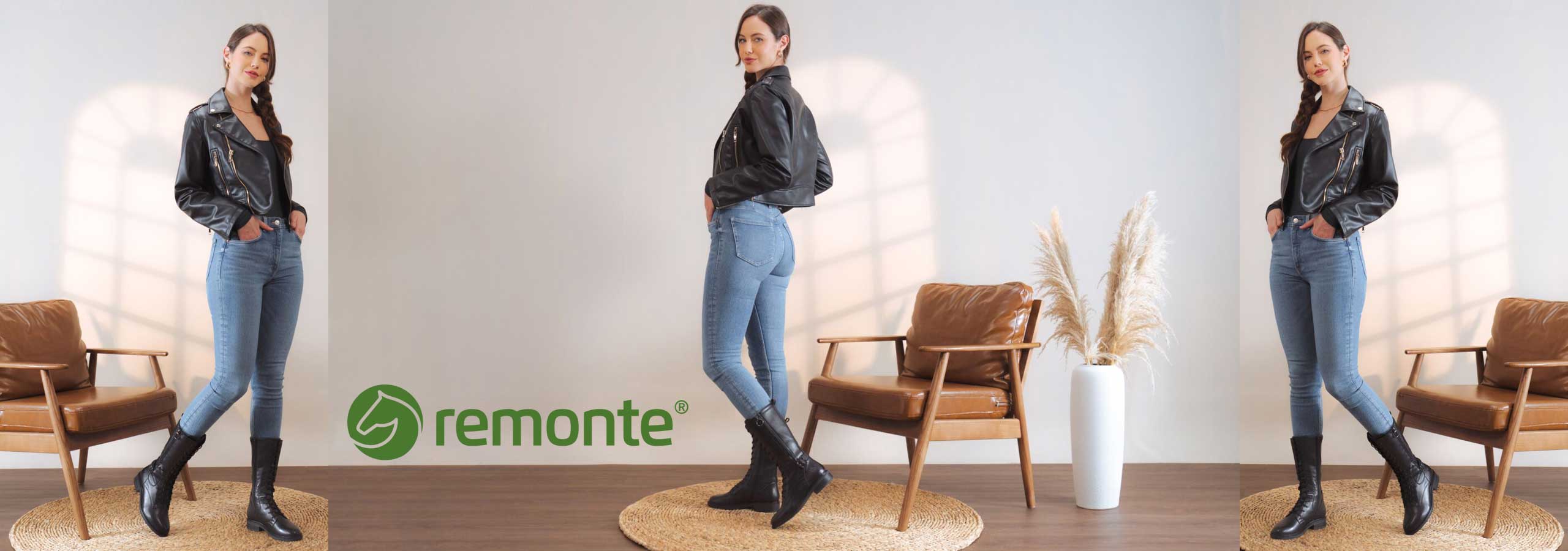 Woman in black leather jacket and blue jeans posing in a room with 'remonte' branding.