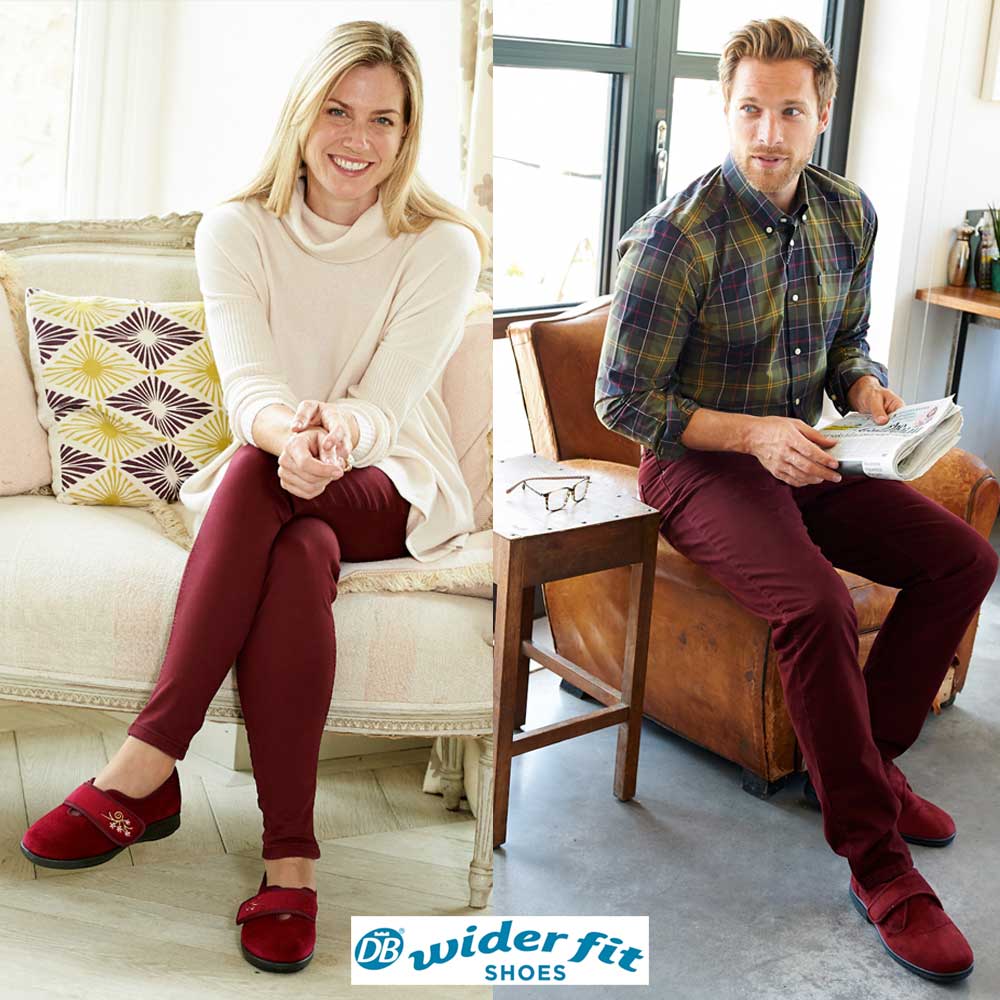 Two people sitting on a couch and chair wearing red shoes with 'DB Wider Fit Shoes' branding.